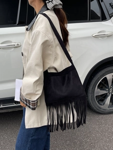 Retro black matte crossbody bag with long tassels and wide shoulder strap for women