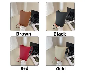 Vertical mini crossbody bucket bag in litchi grain leather featuring four color options