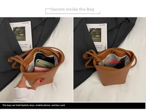 Interior view of brown leather bucket bag showing main pocket for phone and essentials