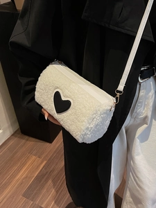 White faux fur heart crossbody bag with golden hardware and long strap for women