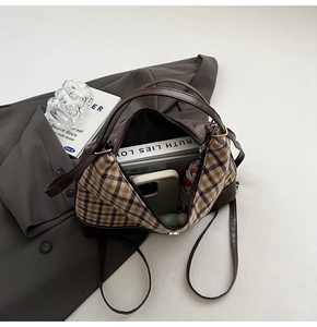 Detailed top view of a large plaid tote bag showing its spacious interior capacity