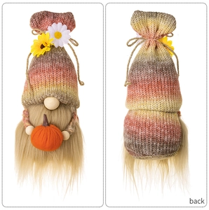 Detailed front and back views of an autumn gnome with pumpkin and sunflower accents