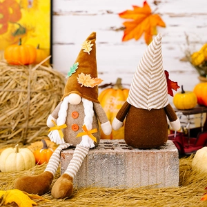 Autumn Harvest Festival gnomes with maple leaf hats and stripe details in fall scene