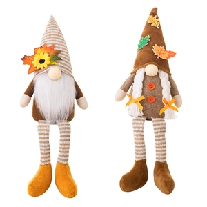 Harvest Festival plush gnomes with sunflower and maple leaf details on long striped legs