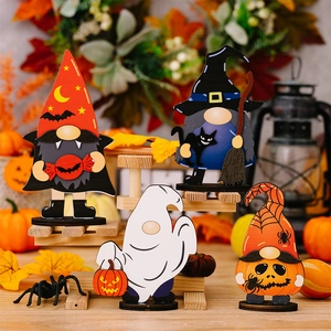 Detail of wooden Halloween gnomes featuring ghost, witch, and pumpkin characters on stand