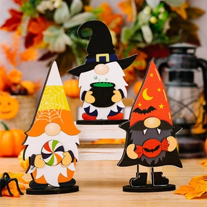 Three wooden Halloween gnomes featuring a witch hat and pumpkin on a rustic autumn background