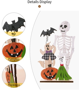 Macro detail showing the multi-layered wooden bat and pumpkin of the Halloween ornament