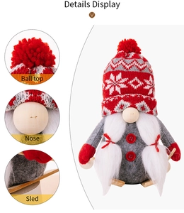Detail display of Christmas gnome with red knitted snowflake hat and wooden sled base