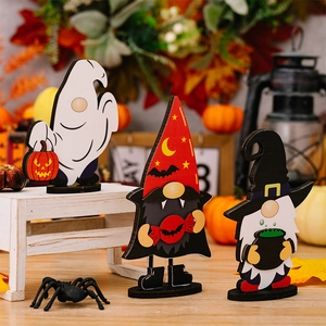 Detail of Halloween wooden gnome ghost set with pumpkin and wizard hat tabletop decor