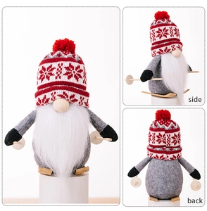 Three-view display of a skiing Christmas gnome with a knitted hat and wooden skis
