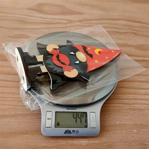 Detailed view of Halloween gnome wooden decor on a scale weighing 447g for shipment