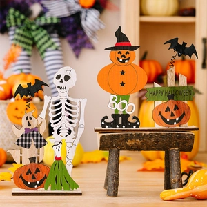 Detailed view of Halloween wooden table ornaments featuring skull and pumpkin characters