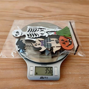 Detailed scale view showing the 35.6g weight of these wooden Halloween ornaments