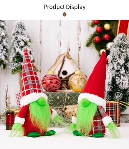 Detail of Christmas gnomes with green faux fur beards and festive knitted hats