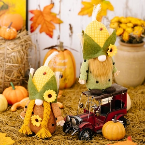 Paire de nains de Thanksgiving avec chapeaux en forme de maïs et tournesols décoratifs