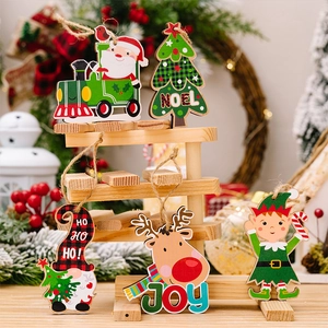 Detailed view of festive wooden Christmas ornaments featuring Santa, reindeer and elves