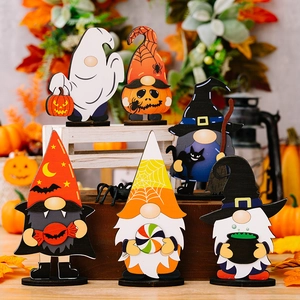Set of 6 wooden Halloween gnome ornaments with pumpkin and ghost motifs on black bases