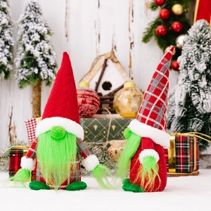Pair of Christmas Grinch gnomes with green beards and festive knit hats for home decor