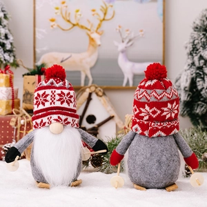 Christmas gnome plush on wooden skis with snowflake knit hat and white beard decoration