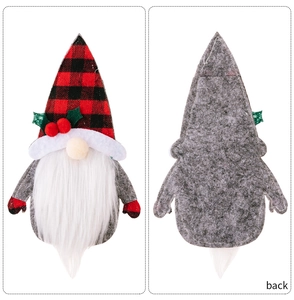 Detail of Christmas gnome cutlery holder showing red plaid hat and grey felt texture