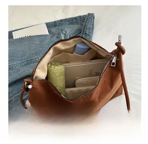 Top view of brown suede tote bag interior showing spacious capacity for daily essentials