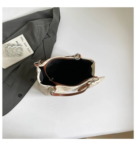 Top view of large tote bag showing black interior lining and brown zippered pocket