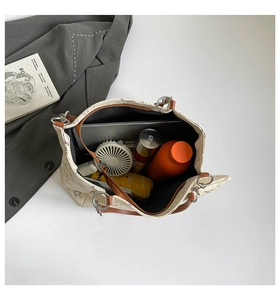 Top-down view of large tote bag showing interior storage capacity for laptop and daily items