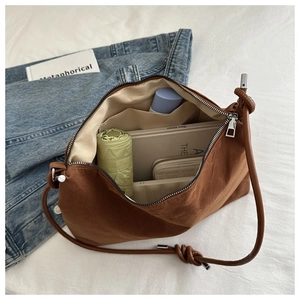 Top view of large capacity brown suede tote bag showing spacious interior for daily items