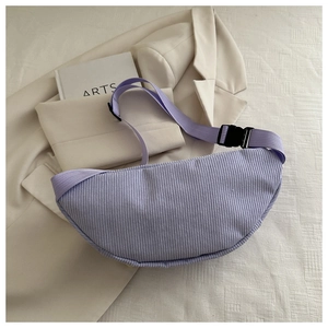 Detail of lavender corduroy texture on minimalist crescent bag with adjustable strap