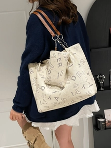 Vintage off-white tote bag with YADIER logo print and brown chain straps for women
