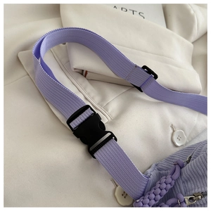 Detail of light purple corduroy waist bag showing adjustable strap and buckle closure