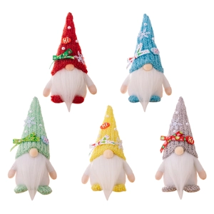Five colorful Christmas gnomes set with knitted hats and white beards on white background