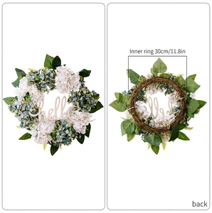 Detail view of hydrangea wreath with hello sign and back natural rattan frame structure