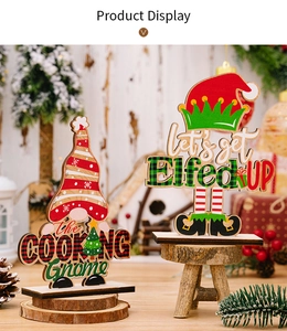 Macro detail of wooden Christmas gnomes with creative festive lettering and stable bases
