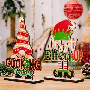 Detail of wooden Christmas gnomes with The Cooking Gnome and Let's Get Elfed UP text