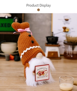 Detail of gingerbread gnome with knit hat and Gingerbread Cafe wooden sign for decor