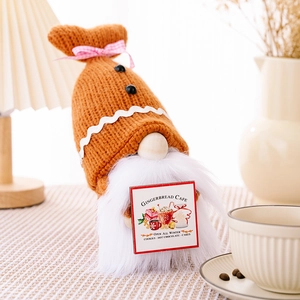 Detail of Gingerbread Cafe gnome plush with knitted hat and festive gingerbread card