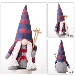 Detail view of red and blue plaid Christmas gnome doll with ski poles and braids