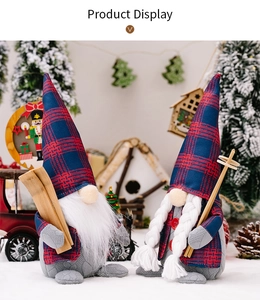 Close-up of festive Christmas gnomes with red and blue plaid hats and skiing accessories