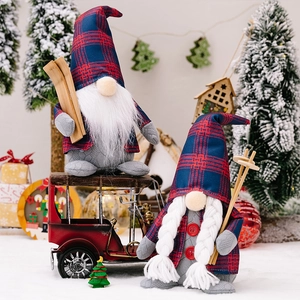 Macro detail of male and female Christmas gnomes in red and blue plaid outfits