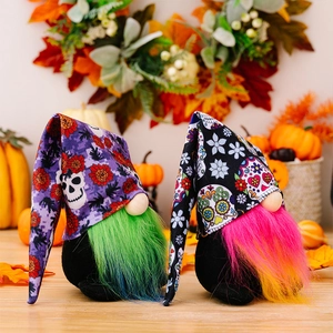 Detail of Halloween gnome figurines with floral hats on light wood table background