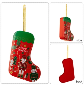Detail of Christmas stocking tin box with Nutcracker print and gold hanging string