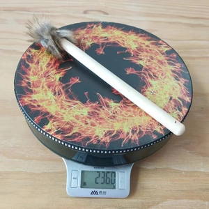 Detail view of Bohemian flame pattern shaman drum with fur drumstick weighing 236 grams