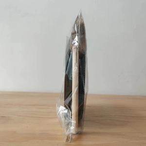 Detail of bohemian percussion drum brush with natural wood handle and animal hair bristles