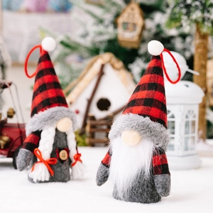 Detail of festive Christmas gnomes with red-black plaid hats and glowing light features