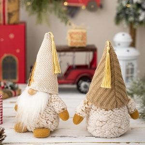 Handmade Christmas gnome set with knitted hats and faux fur beards in festive decor