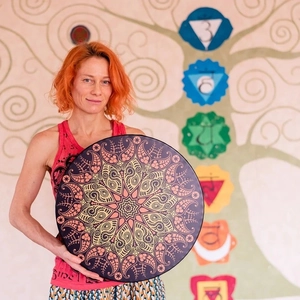 Bohemian shaman frame drum with purple mandala pattern and drumstick for meditation