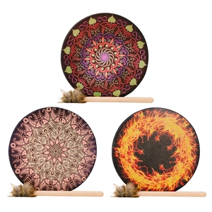 Three Shaman Drums with mandala patterns and wooden drumsticks for festive percussion