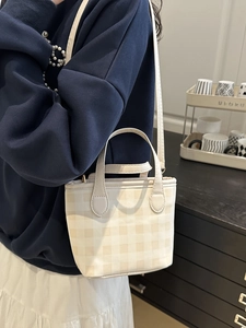 Checkered mini tote bag with top handle and crossbody strap in cream and khaki