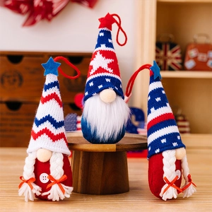Close-up of three patriotic American Independence Day gnomes with stars and stripes patterns